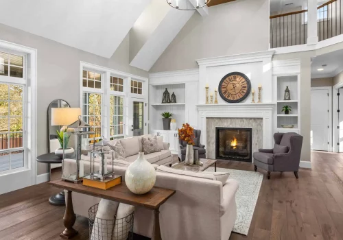 a large, beautiful living room with a fireplace